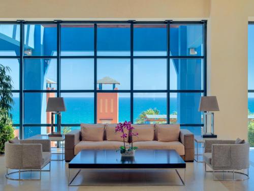 
a living room filled with furniture and a window at H10 Tindaya in Costa Calma
