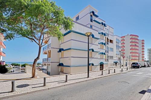 a building on the side of a street at Monte Gordo Beach 1 by Homing in Monte Gordo