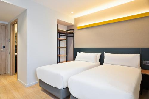 Letto o letti in una camera di Hotel Brick Barcelona