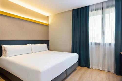 Letto o letti in una camera di Hotel Brick Barcelona