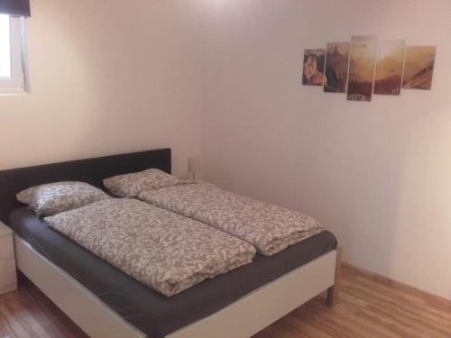 a bed sitting in a room with at Ferienwohnung Zechner in Waidring