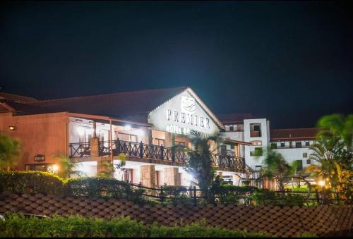 a hotel with a sign on the side of it at night at Ocean View Villas Unit A11 in Port Edward