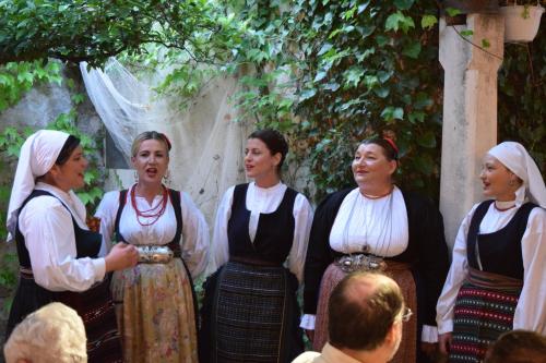 a group of women standing in front of a crowd at Villa Riva in Makarska