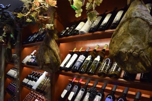 a bunch of bottles of wine are on shelves at Villa Riva in Makarska