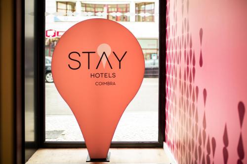 a sign in front of a door with the words stay holders at Stay Hotel Coimbra Centro in Coimbra