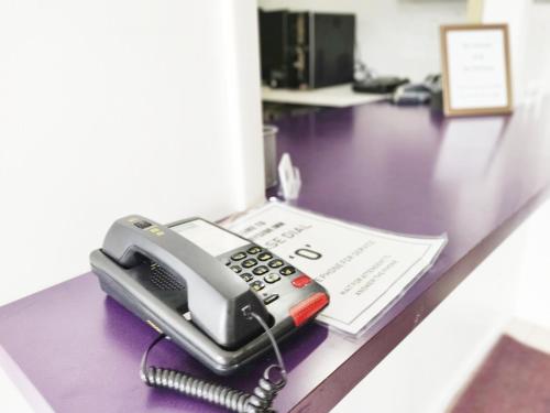 a phone sitting on top of a desk at Countryside Inn Richmondville in Richmondville