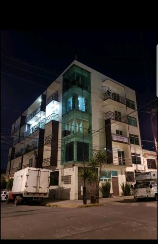 a large building with a truck parked in front of it at Departamento Privado 3 recamaras in Mexico City
