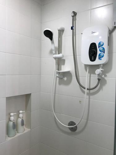 a shower in a bathroom with a shower head at CozyStudio Trefoil Setia Alam in Shah Alam