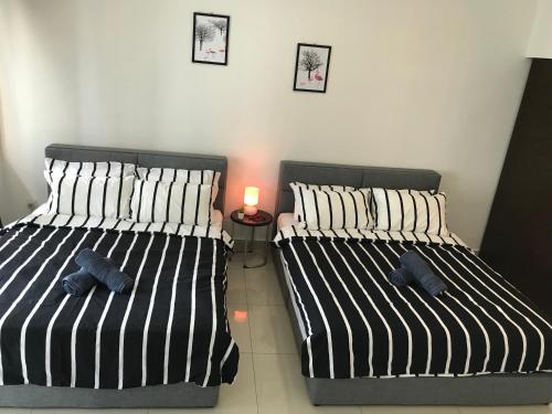 Postel nebo postele na pokoji v ubytování CozyStudio Trefoil Setia Alam