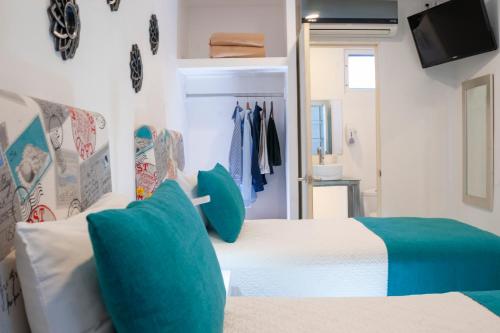 Postel nebo postele na pokoji v ubytování Container Inn Hotel Aeropuerto
