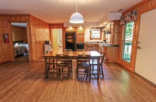 a kitchen and dining room with a table and chairs at Carter Caves State Resort Park in Olive Hill
