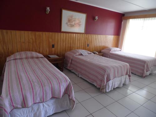 Cama o camas de una habitación en Hotel Manutara