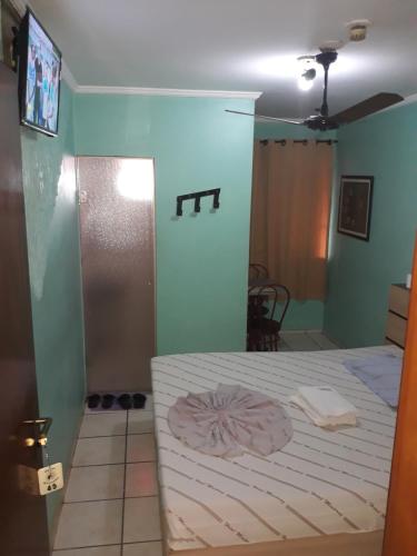 a bedroom with a bed in a room at Hotel Mustang in Sao Paulo