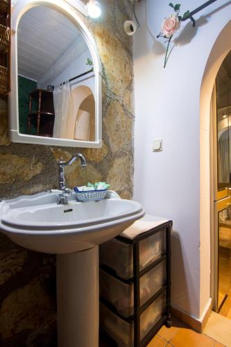 a bathroom with a sink and a mirror at Corfu Town Mini Villa Private Pool Gardens in Mantoúkion