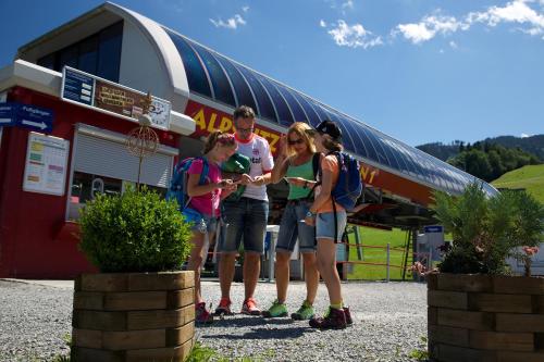 a group of people standing in front of a building at Hotel Gasthof Post in Nesselwang