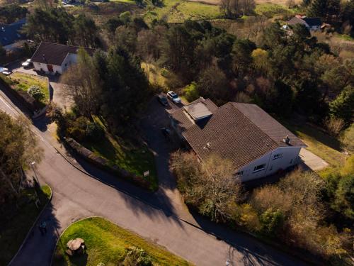 an aerial view of a house with a roof at Braeburn Guesthouse in Fort William