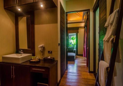 a bathroom with a sink and a mirror at Kirikayan Residences Koh Samui in Mae Nam