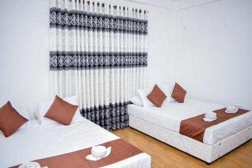 Postel nebo postele na pokoji v ubytování Lion Resort