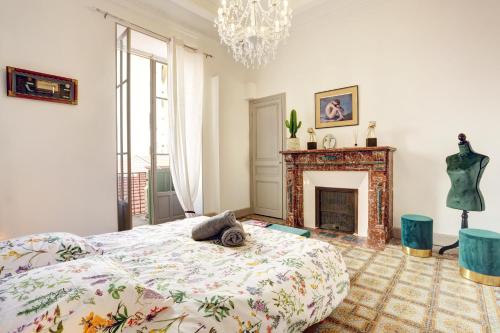 a bedroom with a bed and a fireplace at Le Philibert - SPLENDID, 6 BEDROOMS, 12P, ALL RENOVATED, PORT, A/C in Nice