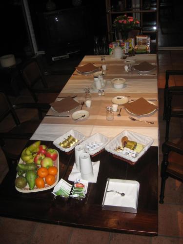 a table with several plates of food on it at B&B De Zeven Berken in Nistelrode