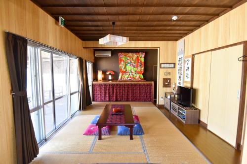 Fotografie z fotogalerie ubytování 古民家 寿（Kominka Kotobuki） v destinaci Nago