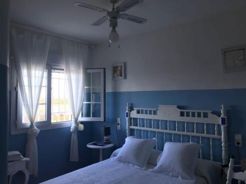Ένα ή περισσότερα κρεβάτια σε δωμάτιο στο Villa Rocio, 1ª línea playa y Parque Natural - planta baja