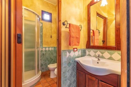 a bathroom with a sink and a shower at Il Leccio in Tortolì