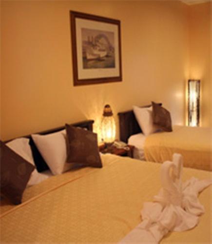 Ένα ή περισσότερα κρεβάτια σε δωμάτιο στο Baanmalai Hotel Chiangrai
