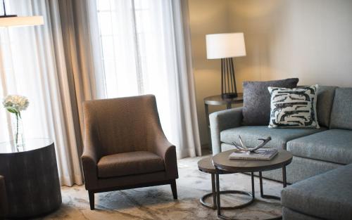a living room with a couch and a chair at Casa De Palmas, Trademark Collection by Wyndham in McAllen