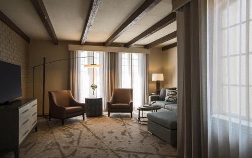 a living room with a couch and chairs and a tv at Casa De Palmas, Trademark Collection by Wyndham in McAllen