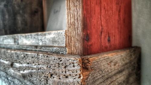 a close up of a wooden door with a red door at Lundsbrunn B&B in Lundsbrunn