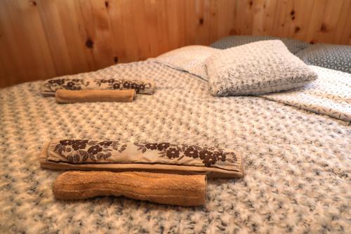 a bed with two animal towels on top of it at Dren - Banjska stena in Mitrovac
