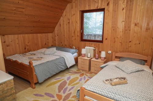 a bedroom with two beds in a cabin at Dren - Banjska stena in Mitrovac