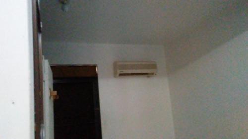 a room with a air conditioner on the wall at Brisas de Borinquen in Aguadilla