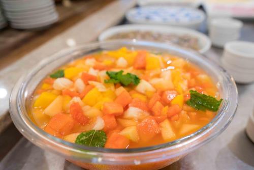 a bowl of food with carrots and other vegetables at Plaza Caldas da Imperatriz Resort & Spa in Santo Amaro da Imperatriz