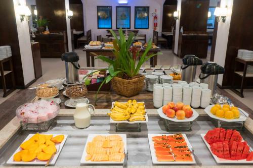a buffet of fruits and vegetables on a table at Plaza Caldas da Imperatriz Resort & Spa in Santo Amaro da Imperatriz