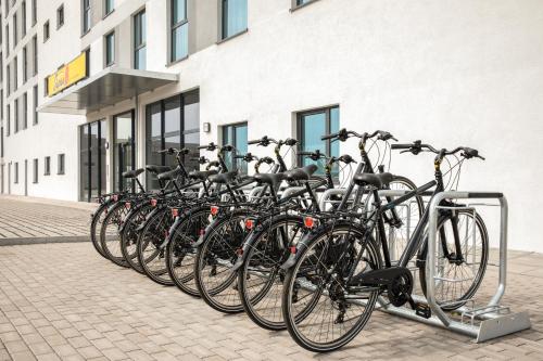 a row of bikes parked in front of a building at Super 8 by Wyndham Oberhausen am Centro in Oberhausen