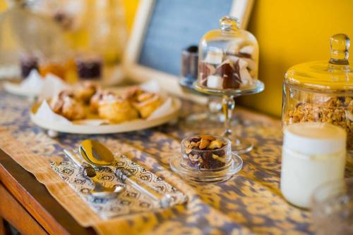 a table with a counter top with food and a bottle of milk at Tra gli Alberi e il Mare in Sirolo