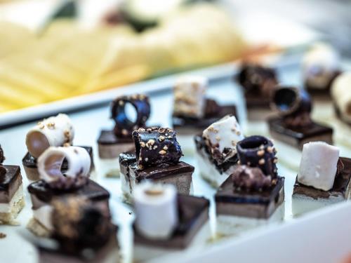 a tray of chocolate desserts on a table at ON Hotels Oceanfront Adults Designed in Matalascañas