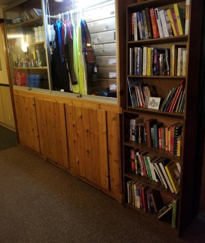 a book shelf filled with lots of books at St. Croix Inn in Solon Springs