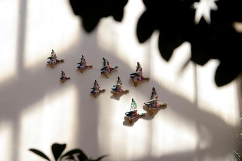 a group of small toy figurines on a wall at Hotel Flora in Venice