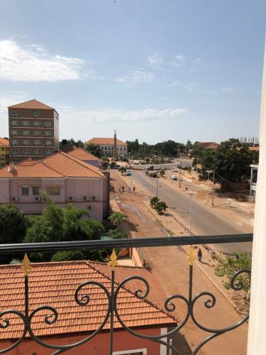 a view of a city street from a balcony at Bissau Royal Hotel in Bissau