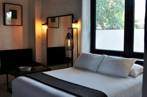 Ένα ή περισσότερα κρεβάτια σε δωμάτιο στο Las Casas B&B Boutique Hotel, Spa & Restaurante Cuernavaca