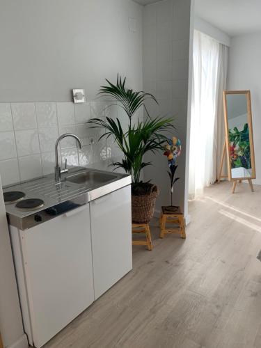 a kitchen with a sink and a counter top at FORMENTERADREAMING SUITe in La Savina