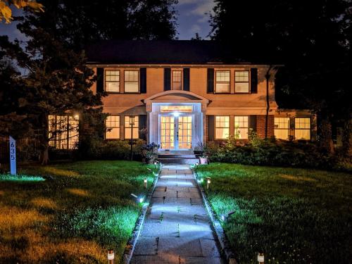 a house with a pathway leading to the front door at night at GuestHouse in Elizabeth