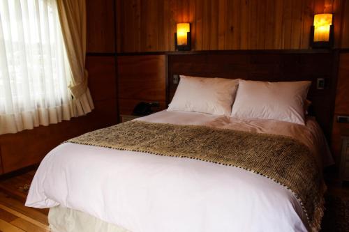 Postel nebo postele na pokoji v ubytování Hotel Aliwen