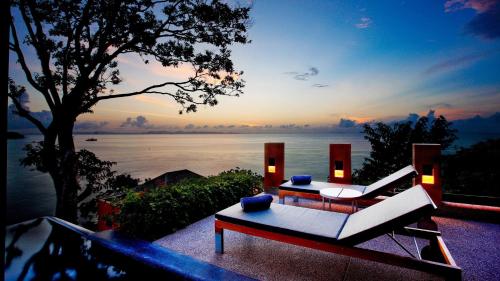 a living room with a view of the water at Sri Panwa Phuket Luxury Pool Villa Hotel - SHA Plus in Panwa Beach