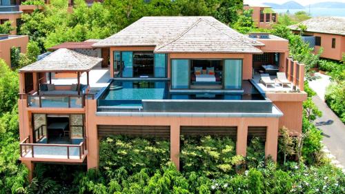 an aerial view of a house with a swimming pool at Sri Panwa Phuket Luxury Pool Villa Hotel - SHA Plus in Panwa Beach
