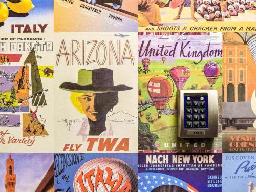 a collage of different types of posters on a wall at hotelF1 Mulhouse Centre Ouest in Mulhouse