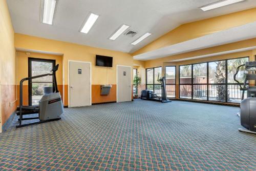a large room with a gym with treadmills at Econo Lodge Florence - Darlington in Florence